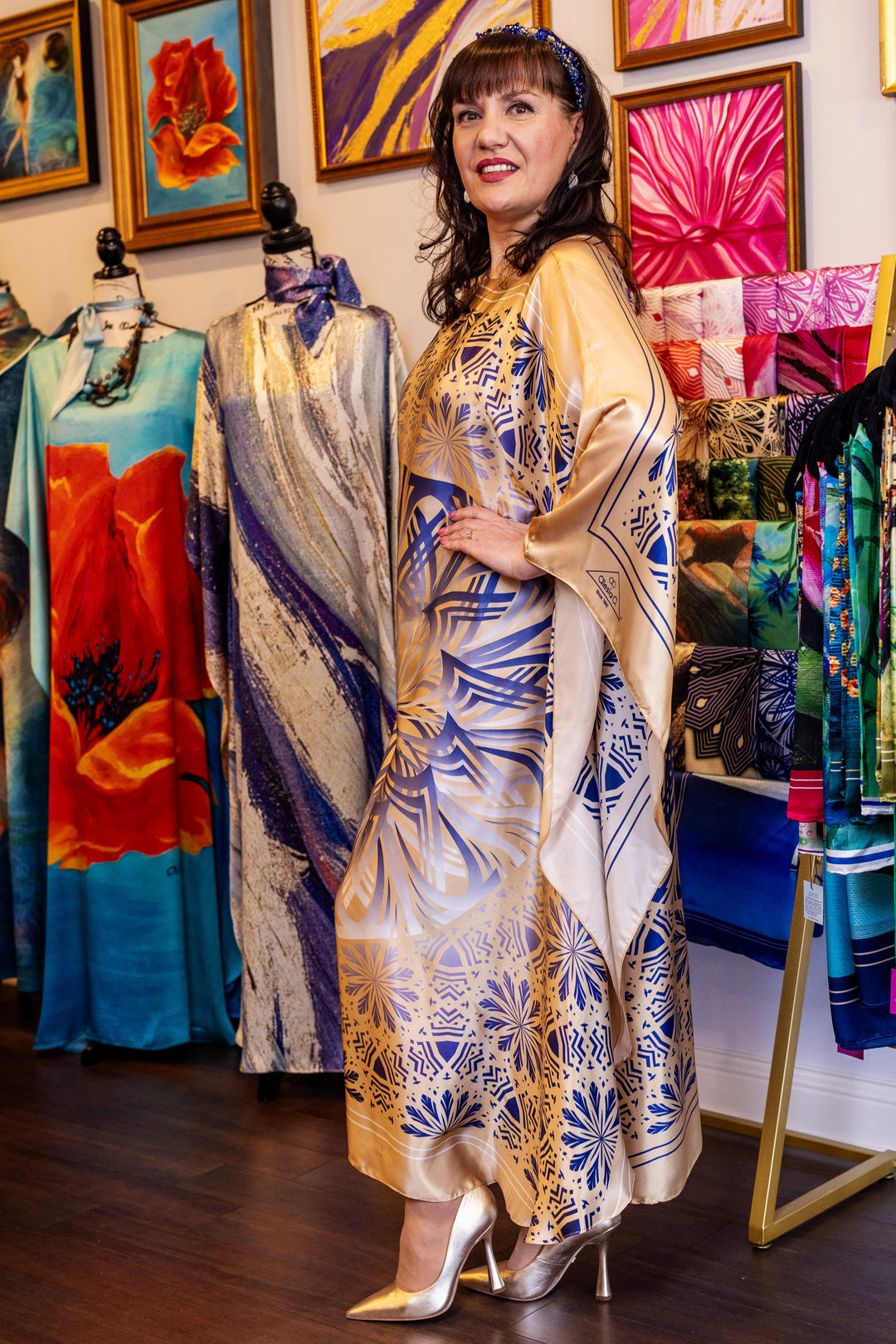 Designer Alesia Chaika in her Alesia C. SERENITY pure silk maxi caftan in a navy blue and gold. AlesiaC.com