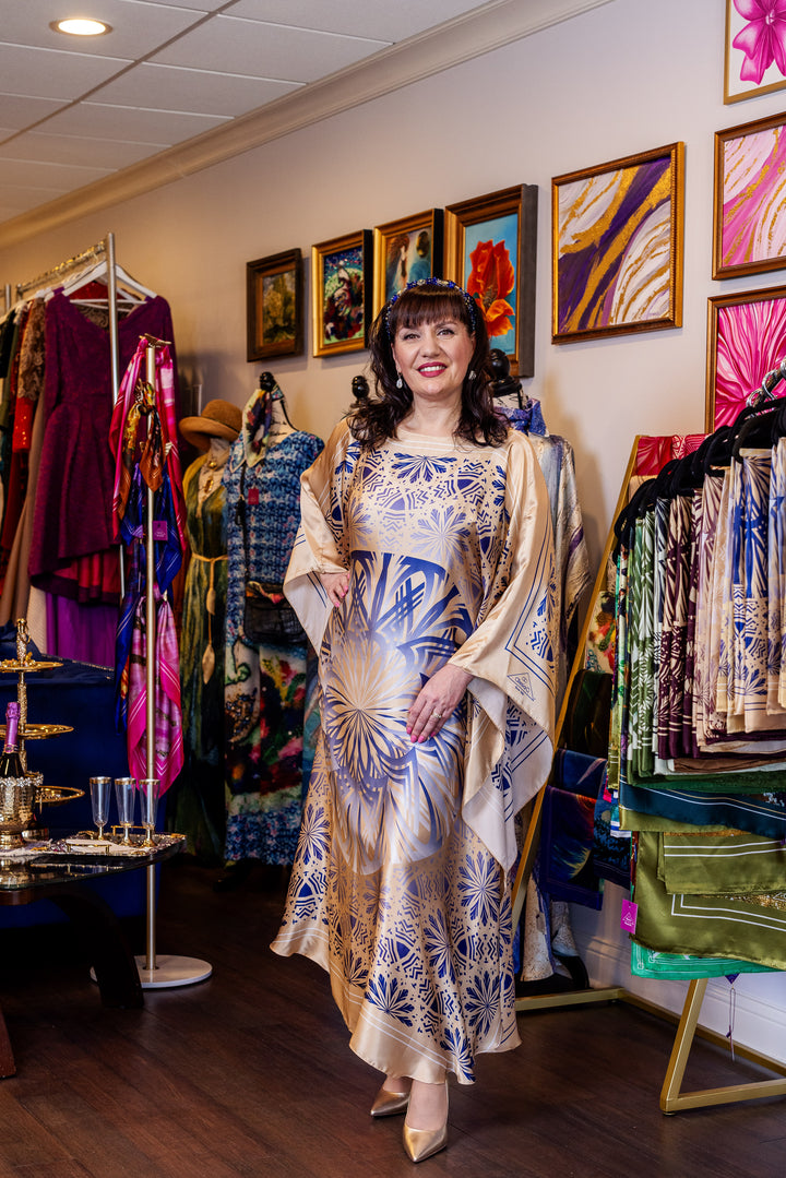 Designer Alesia Chaika in her Alesia C. SERENITY pure silk maxi caftan in a navy blue and gold. AlesiaC.com