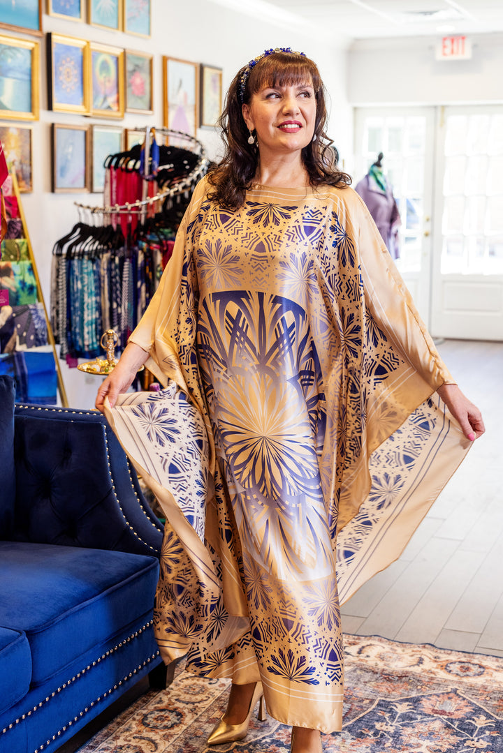 Designer Alesia Chaika in her Alesia C. SERENITY pure silk maxi caftan in a navy blue and gold. AlesiaC.com