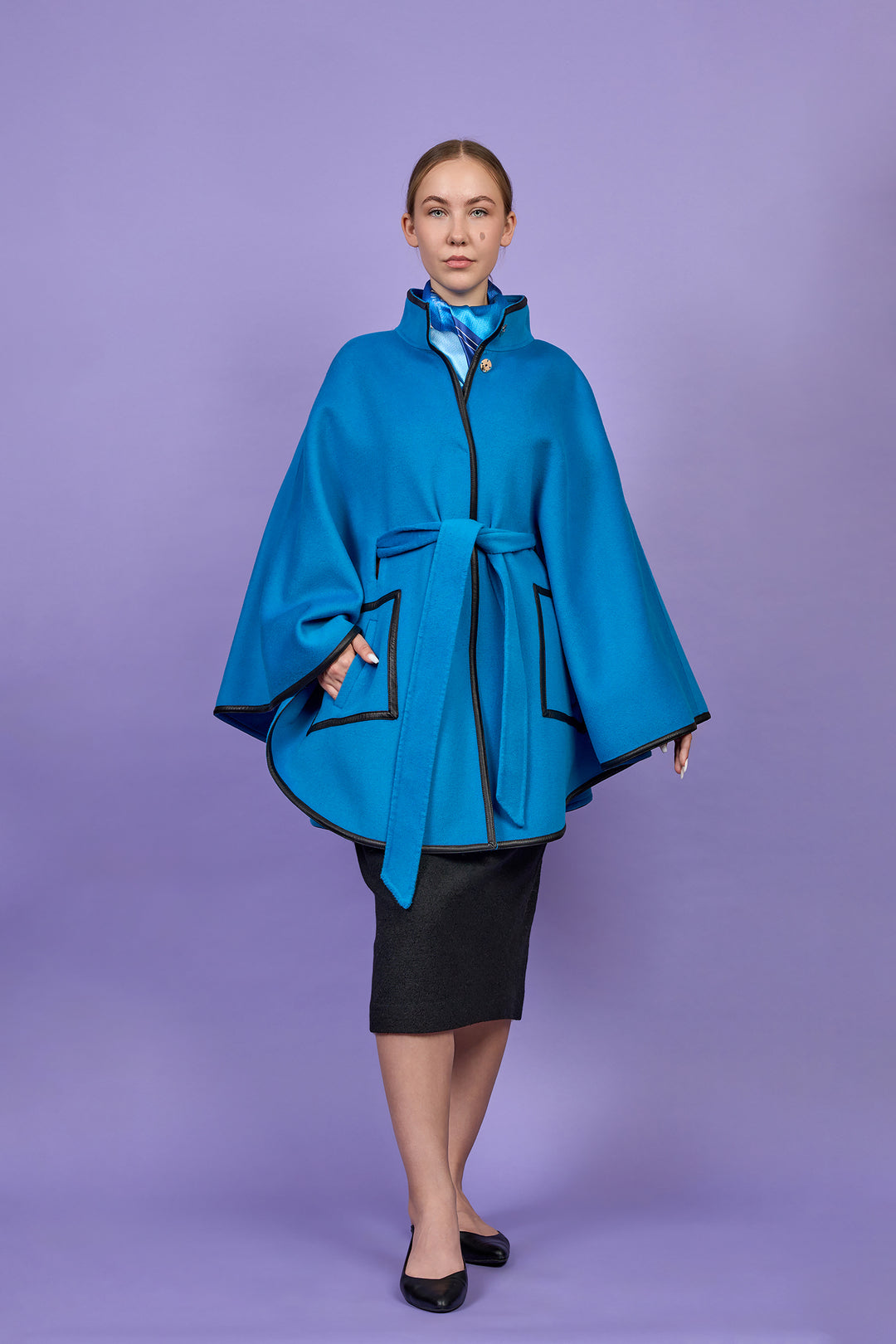 Luxury Bright Blue Belted Cape Coat in Virgin Wool Cashmere With Black Leather Trim in Lake Forest Shop, Illinois, USA fashion designer Alesia C. boutique AlesiaC,com