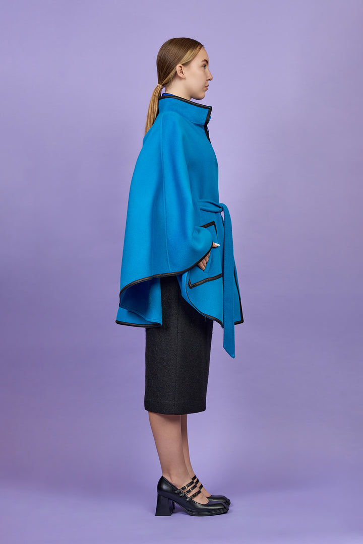 Luxury Bright Blue Belted Cape Coat in Virgin Wool Cashmere With Black Leather Trim in Lake Forest Shop, Illinois, USA fashion designer Alesia C. boutique AlesiaC,com