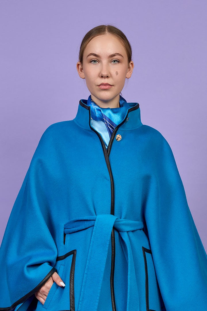 Luxury Bright Blue Belted Cape Coat in Virgin Wool Cashmere With Black Leather Trim in Lake Forest Shop, Illinois, USA fashion designer Alesia C. boutique AlesiaC,com